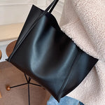 Fashionable black handbag - large capacity, lightweight and easy to carry.