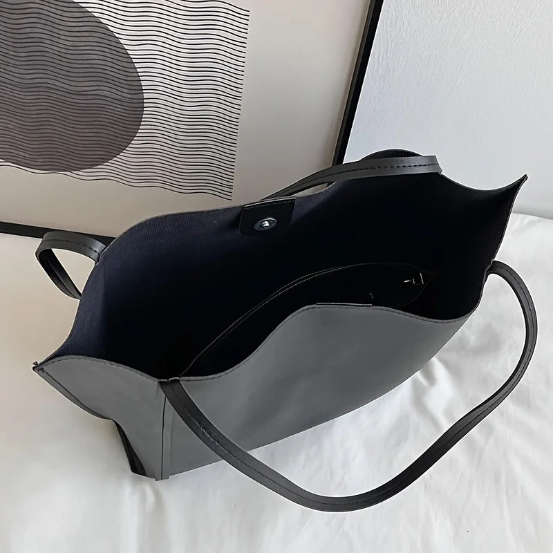 Fashionable black handbag - large capacity, lightweight and easy to carry.