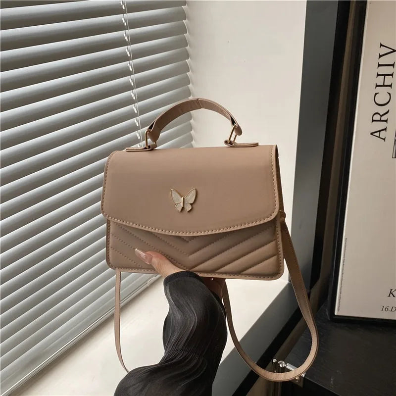 Lucky butterfly bag women's new fashion solid color simple texture trend.